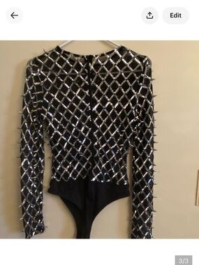 Black mesh bodysuit with metal spikes. Size large, 27” long, thong bottom